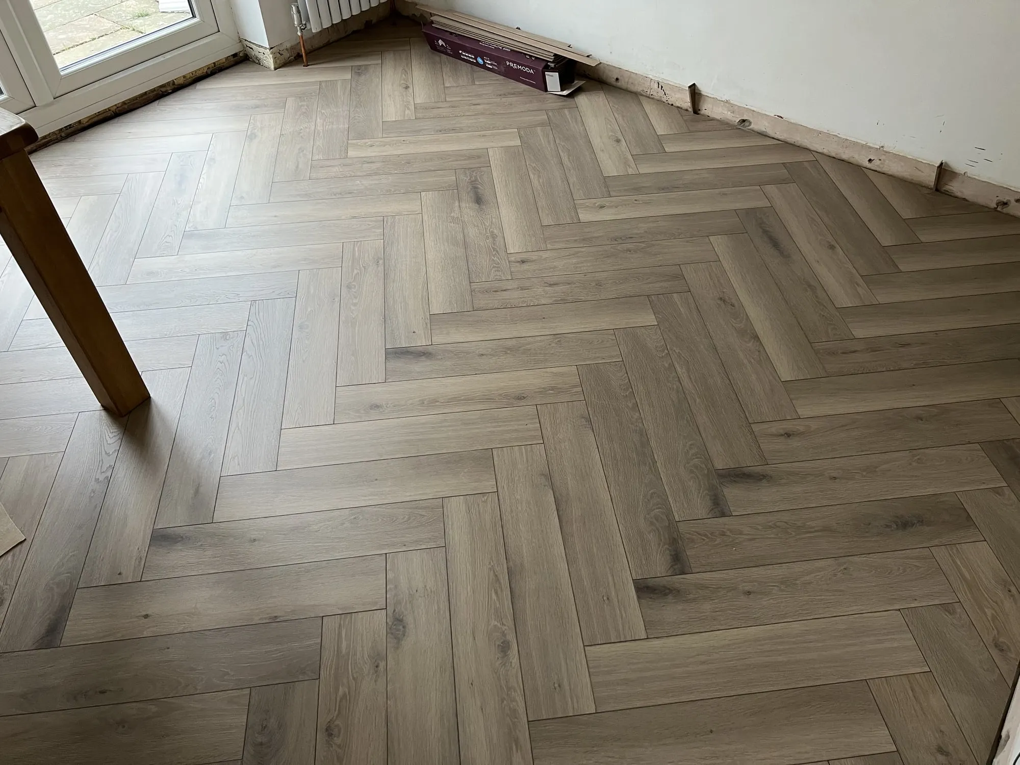 Herringbone laminate (Kronotex), two homes, Grove and Wallingford