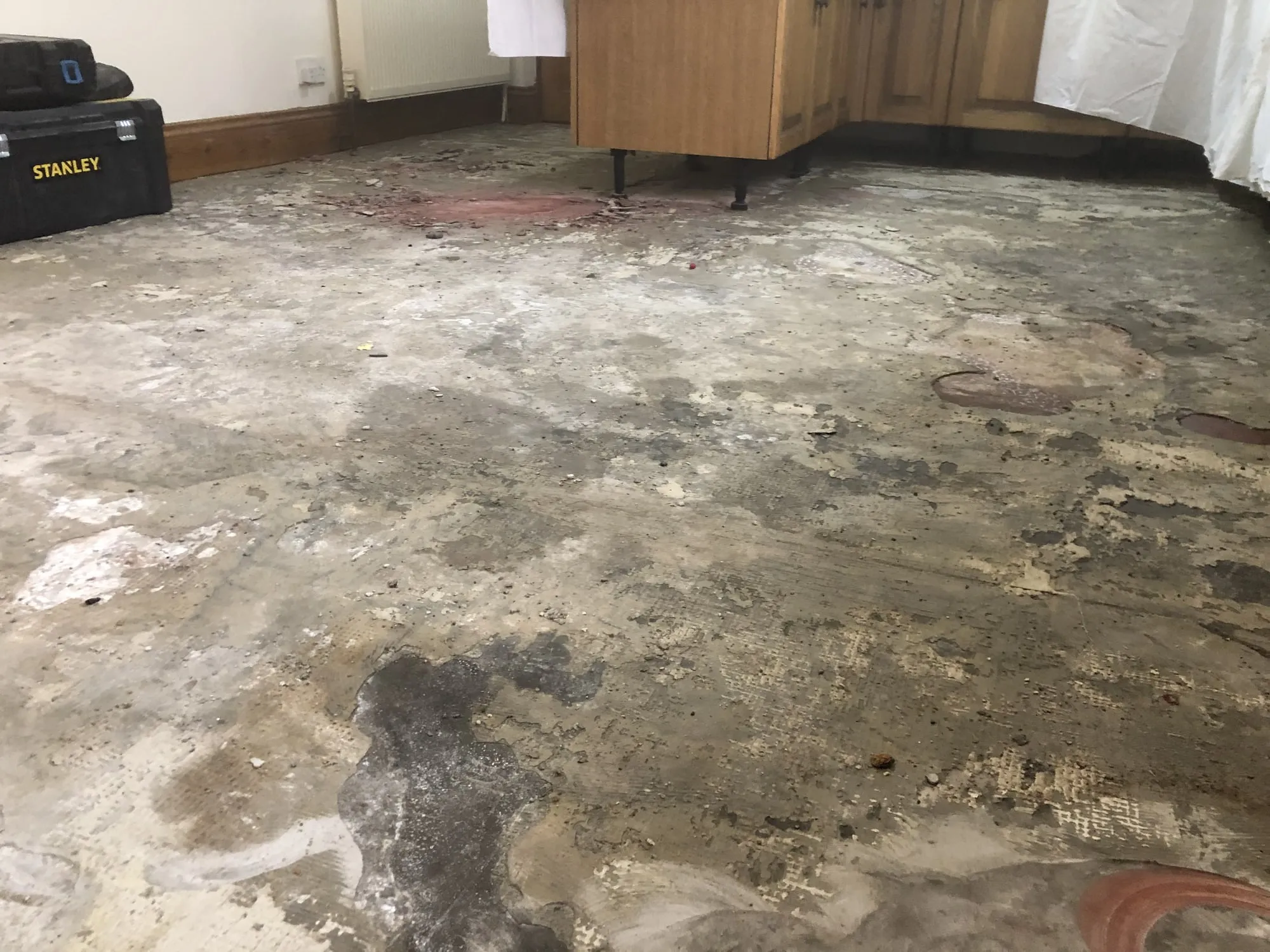Subfloor ground back, then levelled, London